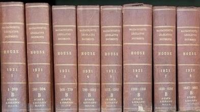 Legislative documents on a bookshelf